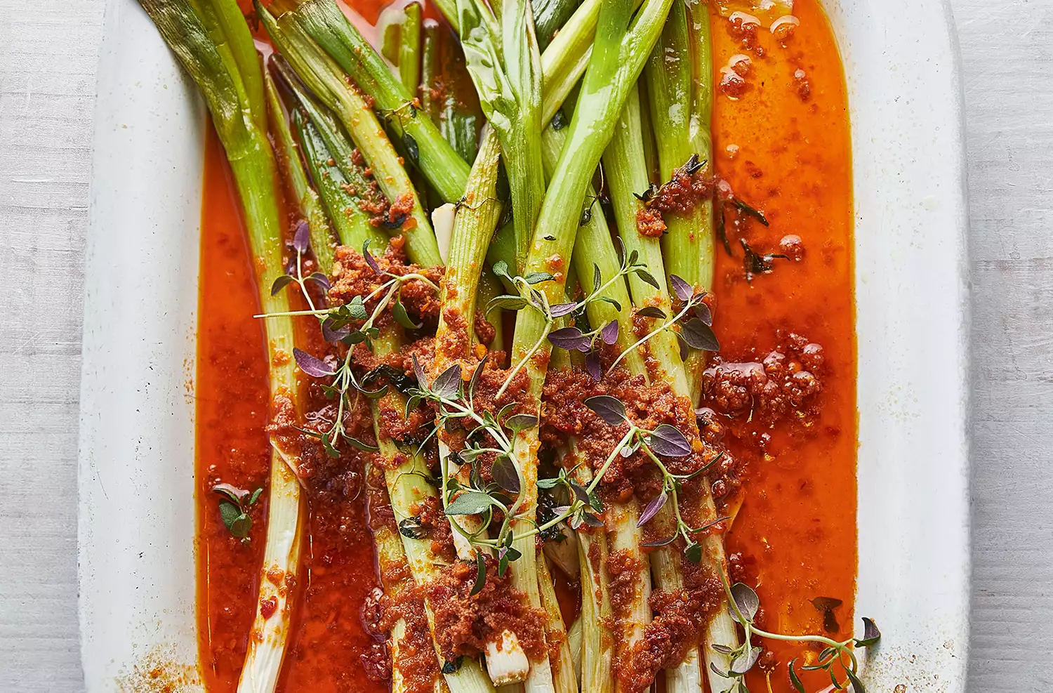 Sherry-braised salad onions with 'nduja butter sauce