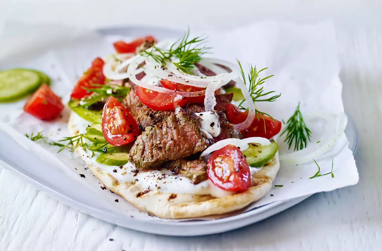 Lamb gyros with tomato salad and garlic yogurt