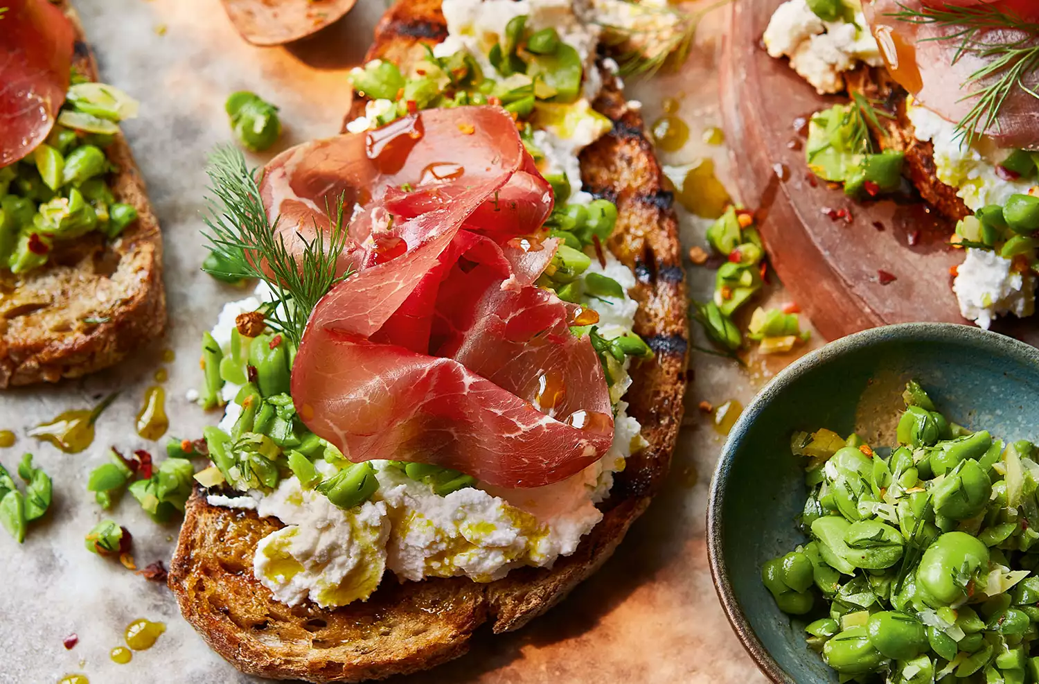 Bresaola, broad bean & ricotta bruschette