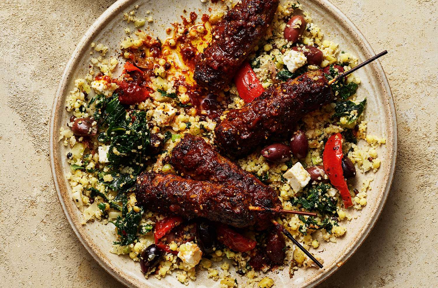 Harissa lamb koftas with antipasti couscous