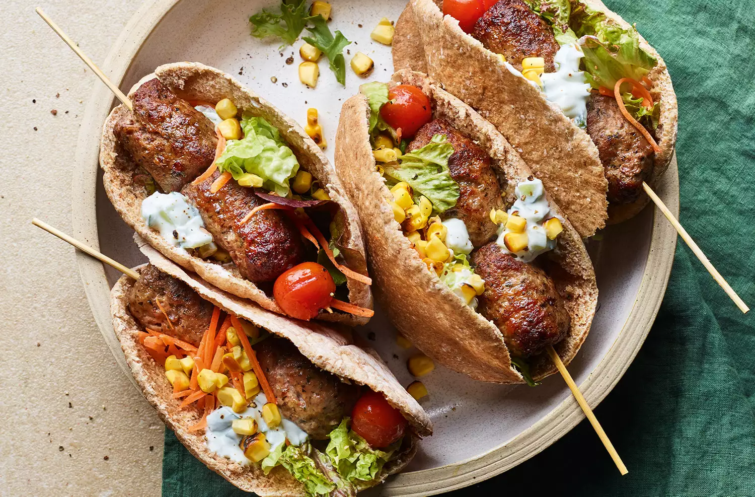 Lamb pitta with cucumber yogurt & charred corn