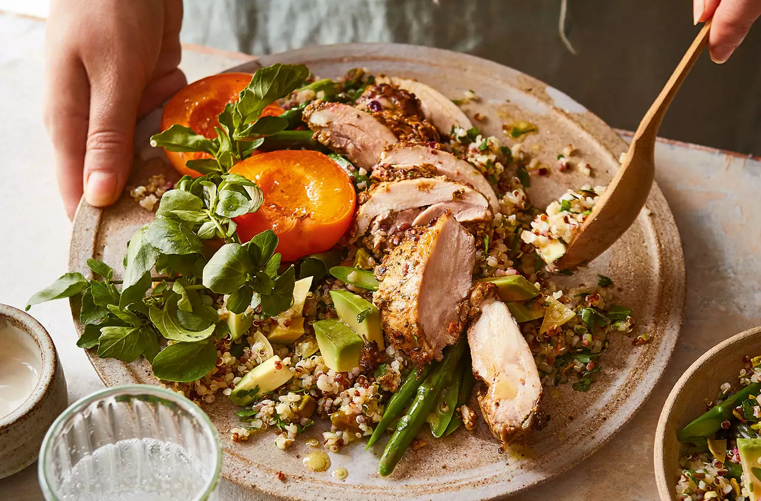 Spiced chicken with warm green herb grains, asparagus, avocado & pistachio