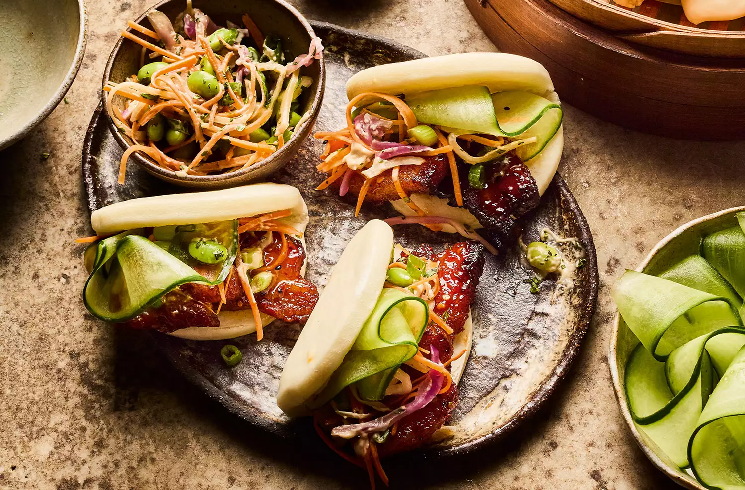 Hot honey pork belly buns with cucumber & slaw